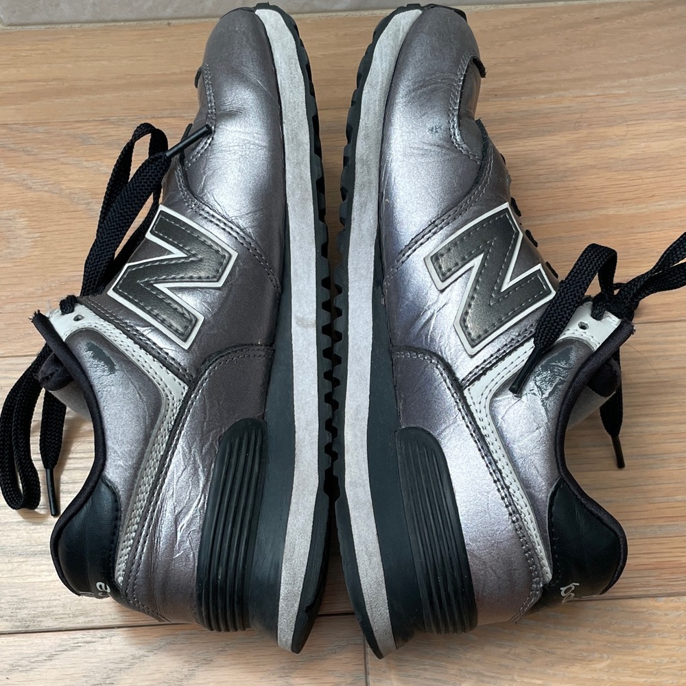 New Balance women’s Metallic Silver and Black Sneakers